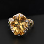 yellow labradorite chrome diopside and zircon flower ring in 18k yellow gold and rhodium over sterling silver shown in a lifestyle photo