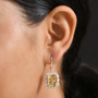 yellow labradorite rainbow moonstone halo earrings in rhodium over sterling silver worn on the ear