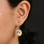 oval yellow labradorite rainbow moonstone halo earrings in rhodium over sterling silver worn on the ear