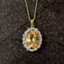 yellow labradorite white zircon halo pendant necklace in 18k yellow gold over sterling silver shown in a lifestyle photo