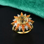 yellow labradorite fire opal and zircon ring in 18k yellow gold over sterling silver shown in a lifestyle photo