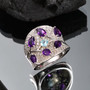amethyst apatite and zircon ring in rhodium over sterling silver shown in a lifestyle photo