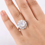 rainbow moonstone apatite and zircon halo ring in rhodium over sterling silver worn on a hand