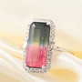 watermelon tourmaline and diamond emerald cut halo ring in 14k white gold shown in a lifestyle photo