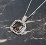 columbianite brown and white zircon double halo pendant neclace in rhodium over sterling silver shown in a lifestyle photo