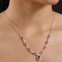 rhodolite garnet and white zircon necklace in 18k rose gold over sterling silver worn around the neck