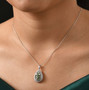 tsavorite garnet and white zircon cluster halo pendant necklace in rhodium over sterling silver worn around the neck