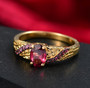 rhodolite garnet ring in 18k yellow gold and black rhodium over sterling silver shown in a lifestyle photo