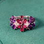 amethyst rhodolite garnet and zircon ring in rhodium over sterling silver shown in a lifestyle photo