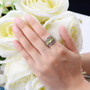 peridot rhodolite garnet and white zircon band ring in rhodium over sterling silver worn on a hand