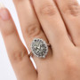 alexandrite and white zircon cluster ring in rhodium over sterling silver worn on a hand