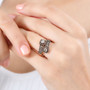 champagne diamond bypass ring in black rhodium and 18k rose gold over sterling silver worn on a hand