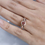 pink apatite brown and white zircon ring in 18k rose gold over sterling silver worn on a hand