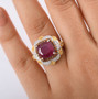 ruby (ff) and multi gemstone regal halo ring in 18k yellow gold and rhodium over sterling silver worn on a hand