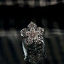 color change garnet and white zircon flower cluster ring in rhodium over sterling silver shown in a lifestyle photo