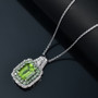 peridot tsavorite garnet and white zircon emerald cut double halo pendant necklace in rhodium over sterling silver shown in a lifestyle photo
