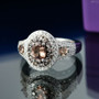 color change garnet and white zircon oval double halo ring in rhodium over sterling silver shown in a lifestyle photo