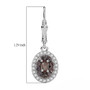 color change garnet and zircon oval double halo lever back earrings in rhodium over sterling silver shown for size comparison