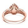 full view of color change garnet and moissanite pear halo ring in 18k rose gold over sterling silver