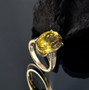 yellow apatite and diamond oval solitaire ring in 10k yellow gold shown in a lifestyle photo