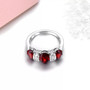 full view of garnet three stone band ring in rhodium over sterling silver