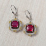 ruby (ff) and multi gemstone regal halo earrings in 18k yellow gold and rhodium over sterling silver shown in a lifestyle photo