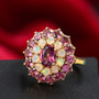 rhodolite garnet and ethiopian opal double halo ring in 18k yellow gold over sterling silver shown in a lifestyle photo