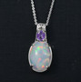 ethiopian opal and purple sapphire pendant necklace in rhodium over sterling silver shown in a lifestyle photo