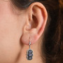 ceylon blue sapphire and zircon leverback earrings in rhodium over sterling silver worn on the ear