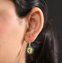 peridot chrome diopside and zircon halo leverback earrings in rhodium over sterling silver worn on the ear