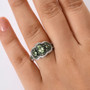 tsavorite garnet and zircon trilogy double halo ring in rhodium over sterling silver worn on a hand