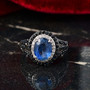kyanite blue sapphire and zircon ring in rhodium over sterling silver shown in a lifestyle photo