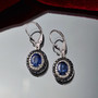 kyanite blue sapphire and zircon leverback earrings in rhodium over sterling silver shown in a lifestyle photo