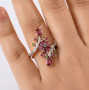 rhodolite garnet chrome diopside and white zircon bypass ring in 18k rose gold over sterling silver worn on a hand
