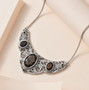 chocolate sapphire and smoky quartz bib necklace in rhodium over sterling silver shown in a lifestyle photo