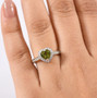 sapo green tourmaline and diamond heart halo ring in solid 10k yellow gold worn on a hand