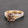 cushion cut brown diamond split shank ring in solid 18k yellow gold shown in a lifestyle photo