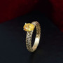 yellow sapphire oval solitaire openwork 10k yellow gold ring shown in a lifestyle photo