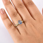 blue sapphire oval solitaire openwork 10k yellow gold ring worn on a hand