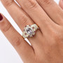 purple spinel rhodolite and moissanite regal double halo ring in 18k yellow gold over sterling silver worn on a hand