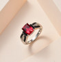 lab padparadscha sapphire and black spinel ring in black and white rhodium over sterling silver shown in a lifestyle photo