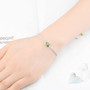 peridot and white zircon bracelet in rhodium over sterling silver