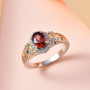 red and white zircon oval halo ring in two-tone 18k yellow gold and rhodium over sterling silver shown in a lifestyle photo
