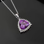 lab color change sapphire and lab diamond trillion halo pendant necklace in 10k white gold shown in a lifestyle photo