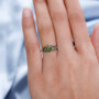 vesuvianite ring in black and white rhodium over sterling silver worn on a hand