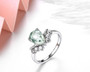 close up of prasiolite and white zircon ring in rhodium over sterling silver