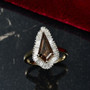 bronze diaspore and lab diamond kite halo ring in 10k yellow gold shown in a lifestyle photo