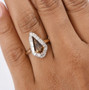 bronze diaspore and lab diamond kite halo ring in 10k yellow gold worn on a hand