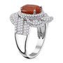 side view of orange kyanite and moissanite bypass halo ring in rhodium over sterling silver