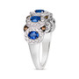 side view of blue sapphire white and brown diamond oval ring in 14k white gold